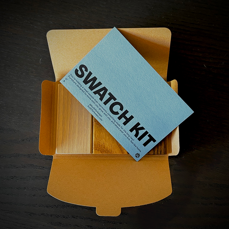 Keeps Swatch Kit with wooden swatches and a blue card on a dark surface