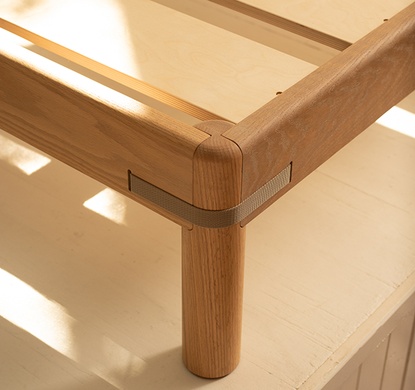 Keeps Signature Strap bed frame solid oak joinery with premium birch slats in light natural finish and sunlight